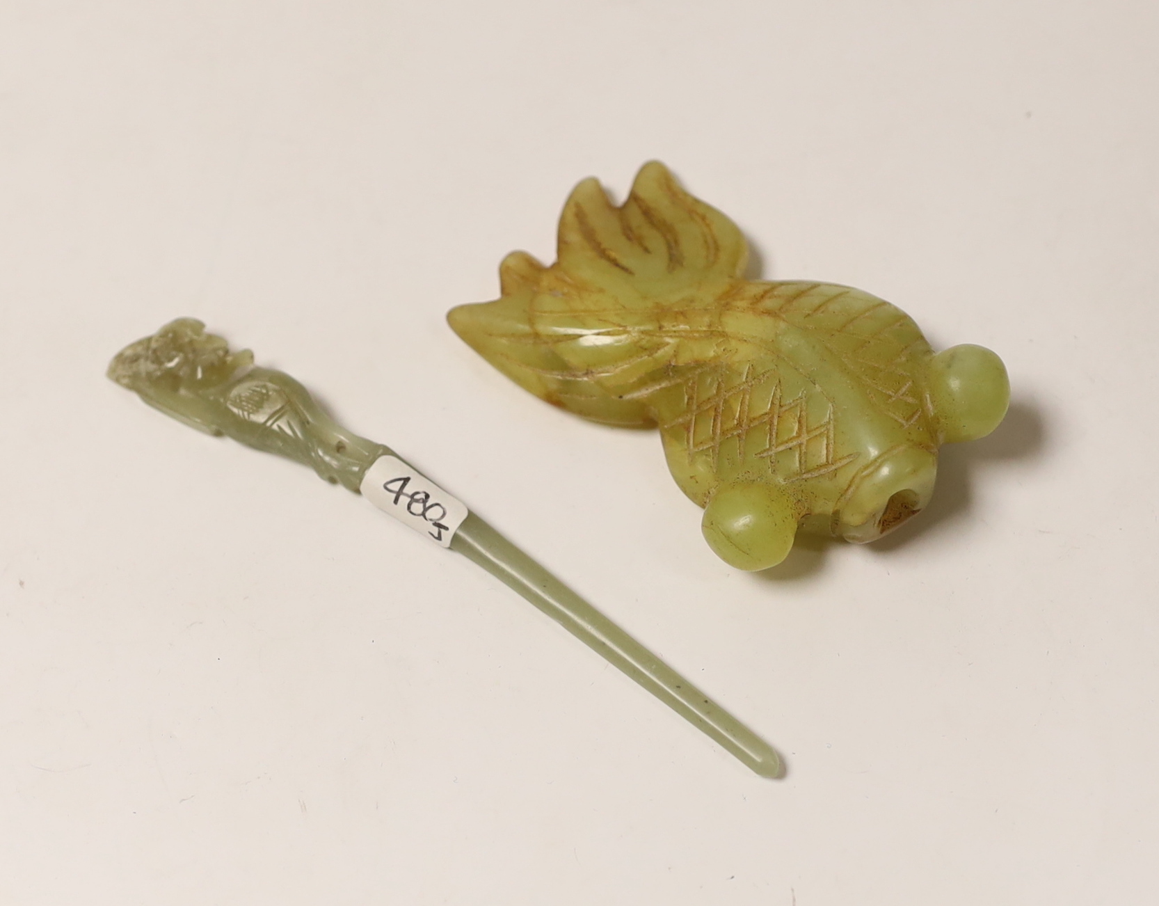 A Chinese greenish-yellow and russet jade goldfish and a pale celadon jade hairpin, 11cm in length